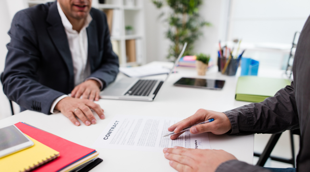 business people reviewing contract